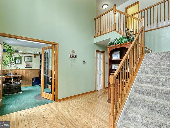 Two story foyer - double glass door open to office
