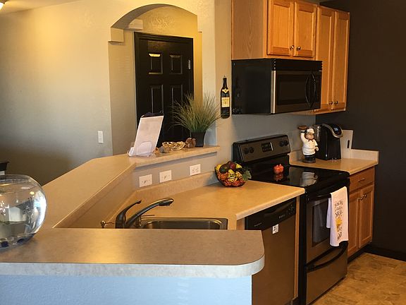 Kitchen with large pantry and stainless appliances