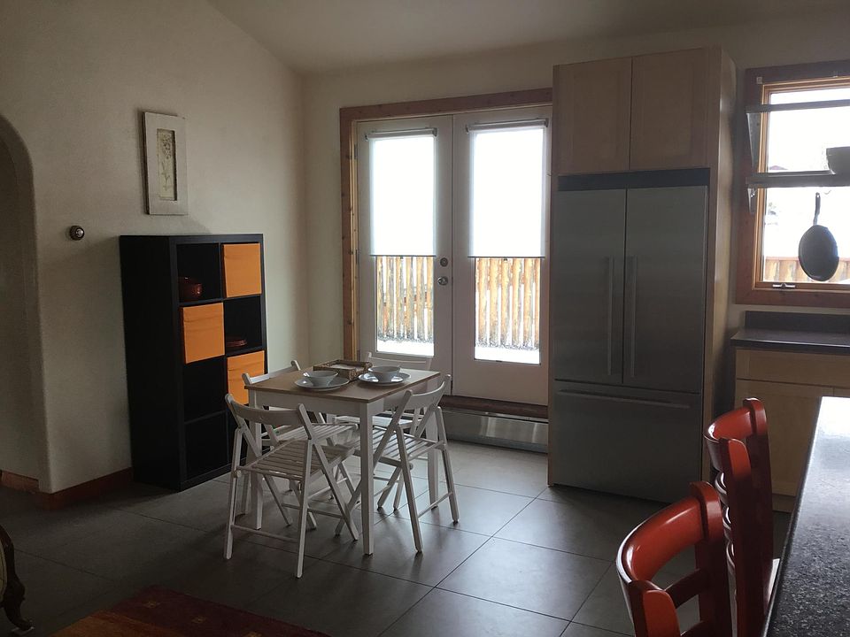 This is a dining area next to the French doors that access the deck. The deck has views of Howelson and Werner.