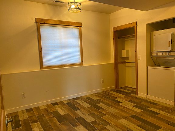 Bedroom and washer and dryer for apartment.