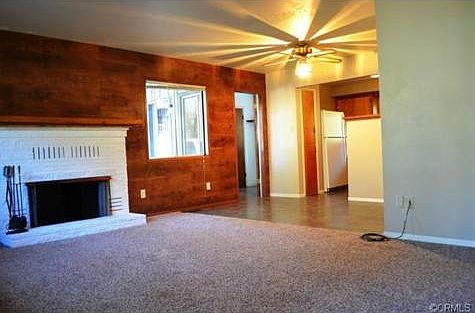 Spacious living room area is open to the kitchen and eating area