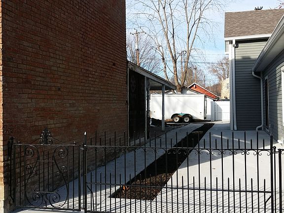 Restored wrought iron fence.