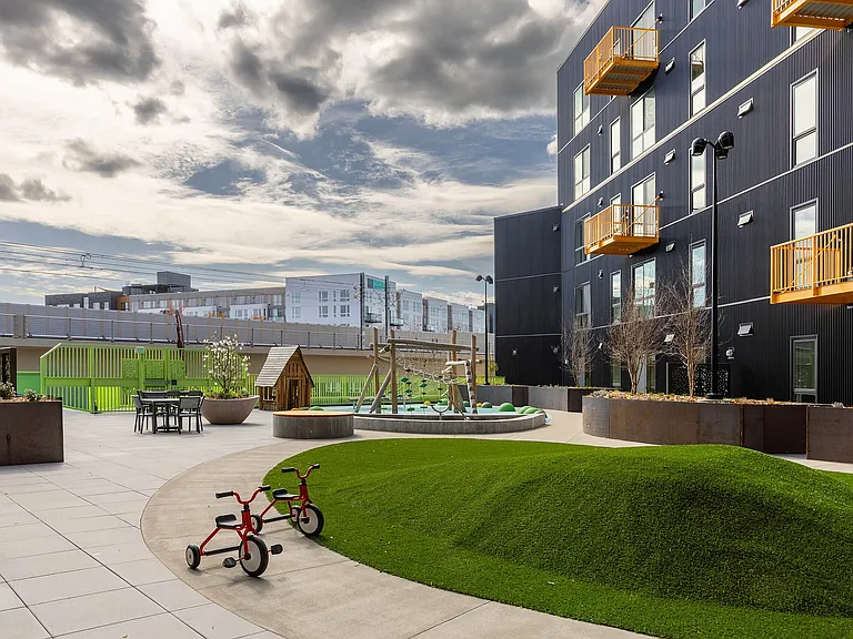 East Building Backyard amenity featuring an outdoor play area