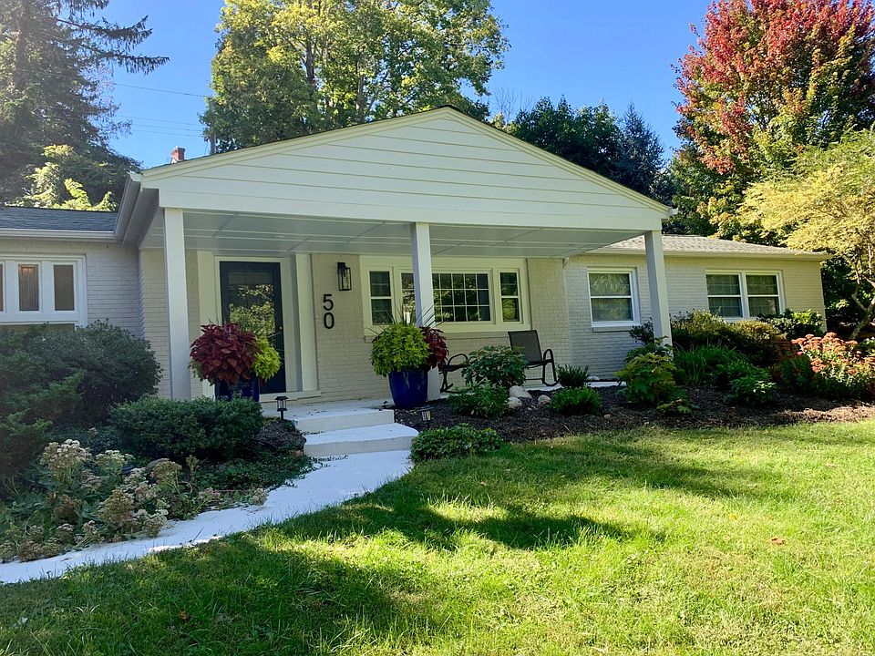 Newly painted exterior with covered front porch facing the golf course