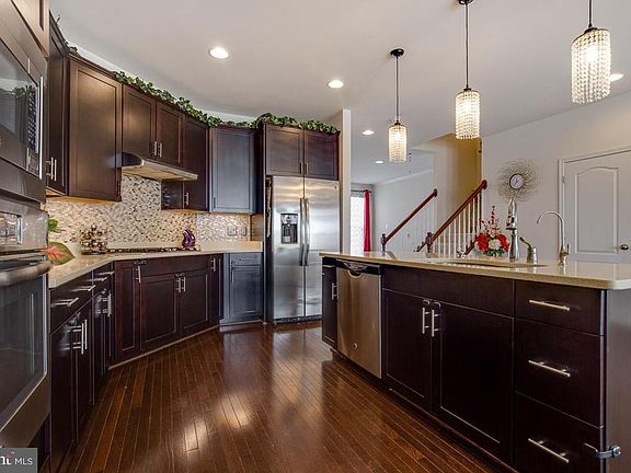 Kitchen with hardwood floors on main level.