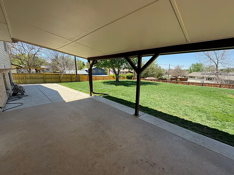 covered back patio, large fully fenced backyard (lawncare included in rent)