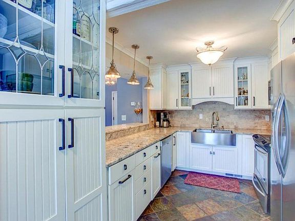 Updated kitchen with stainless steel appliances.