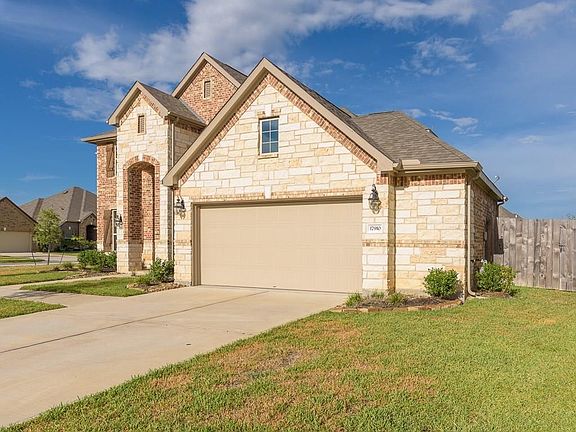 The garage has a 5' extension so there's plenty of room for 2 cars plus extra storage!