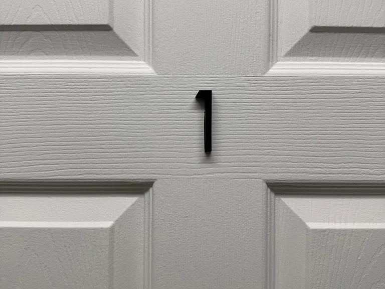 Numbered door/entry detail (Unit 1) with paneled design for easy identification and access.