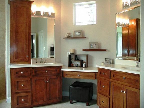 More site built cabinetry and travertine flooring.