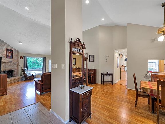 This home has open living and dining areas with laminate wood and tile floors throughout the home.