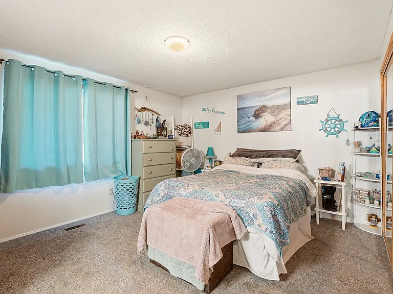 The main bedroom is large with newer carpets, as in all bedrooms and entire downstairs