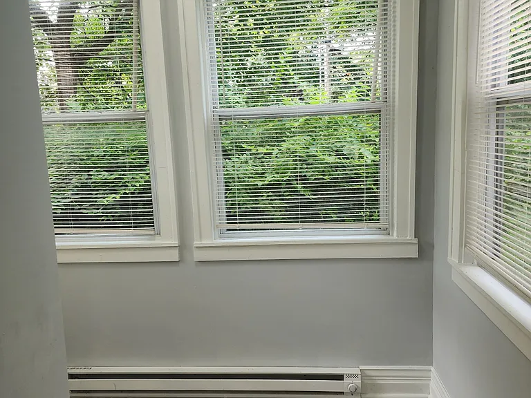 View into the Sunroom from the bedroom. Can be used for a small office, reading room, or just extra storage
