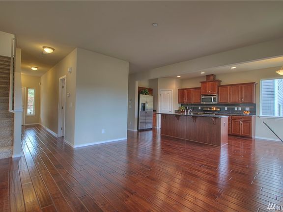 Great Room with Staircase Leading Up to 4 Large Bedrooms That All Have Walk In Closets!