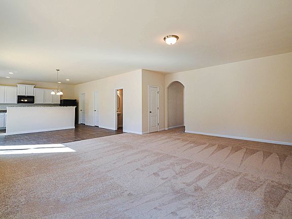 Huge living room connects to dining and kitchen areas
