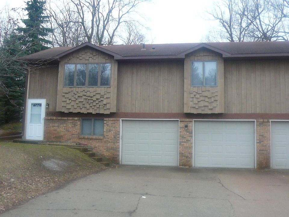 Two car garage with a lot of off street parking.