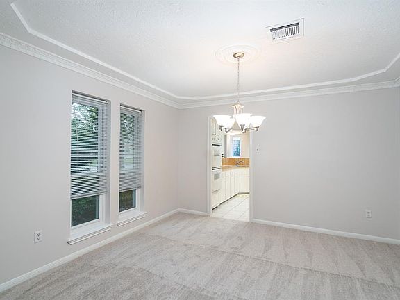 All of the carpet in the home was just installed including here in the dinging room along with the chandelier.
