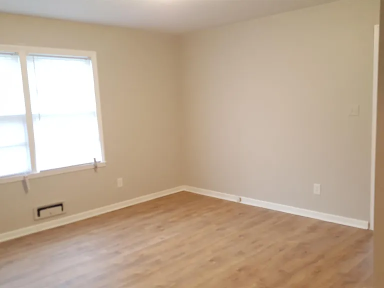 Large master bedroom with built-ins and 2 closests