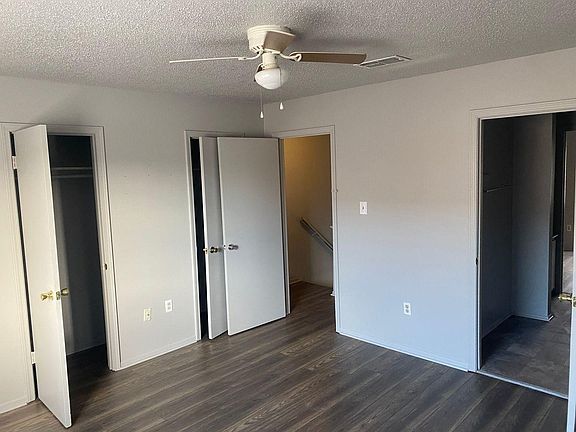 Master bedroom with his and hers closet