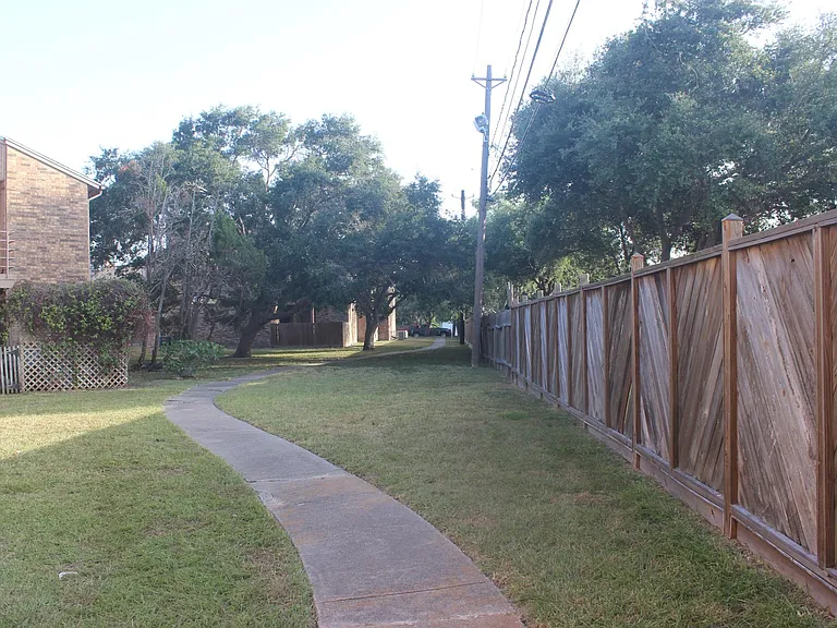 walking trail around the small condo complex. back fence direct access to the sidewalk.