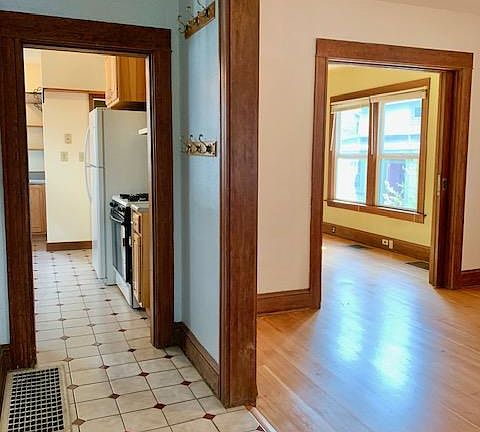 Entry way looking into living room & kitchen