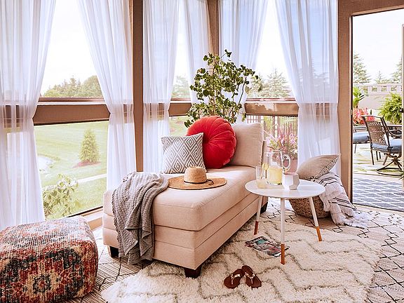 Verona bonus model showing the view of the screened-in porch, and out to the courtyard.