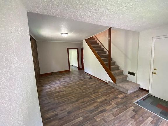 Living room and stairway to upper bedroom