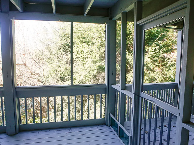 Exterior lowest deck/porch with access to back stairs