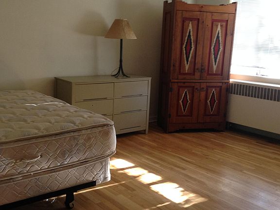 Very large bedroom with door and hall to living room