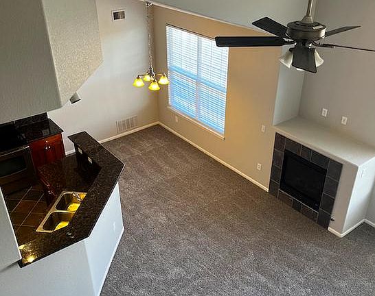 View from upstairs down to kitchen/living room/dining room