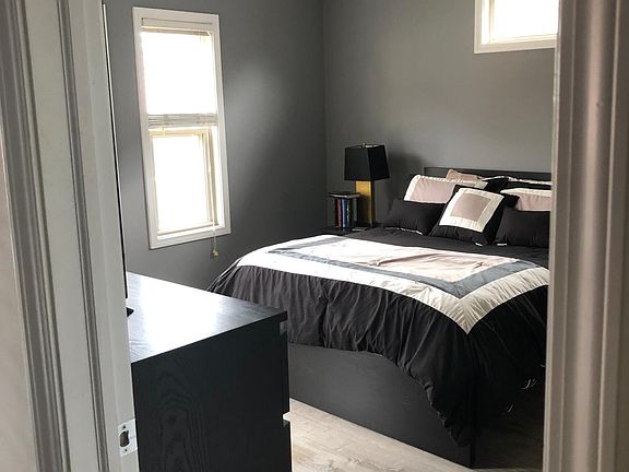 Master Bedroom with ceiling fan and plenty of natural lighting!
