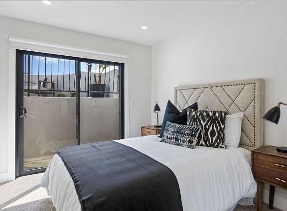 Spacious and bright bedroom with access to patio