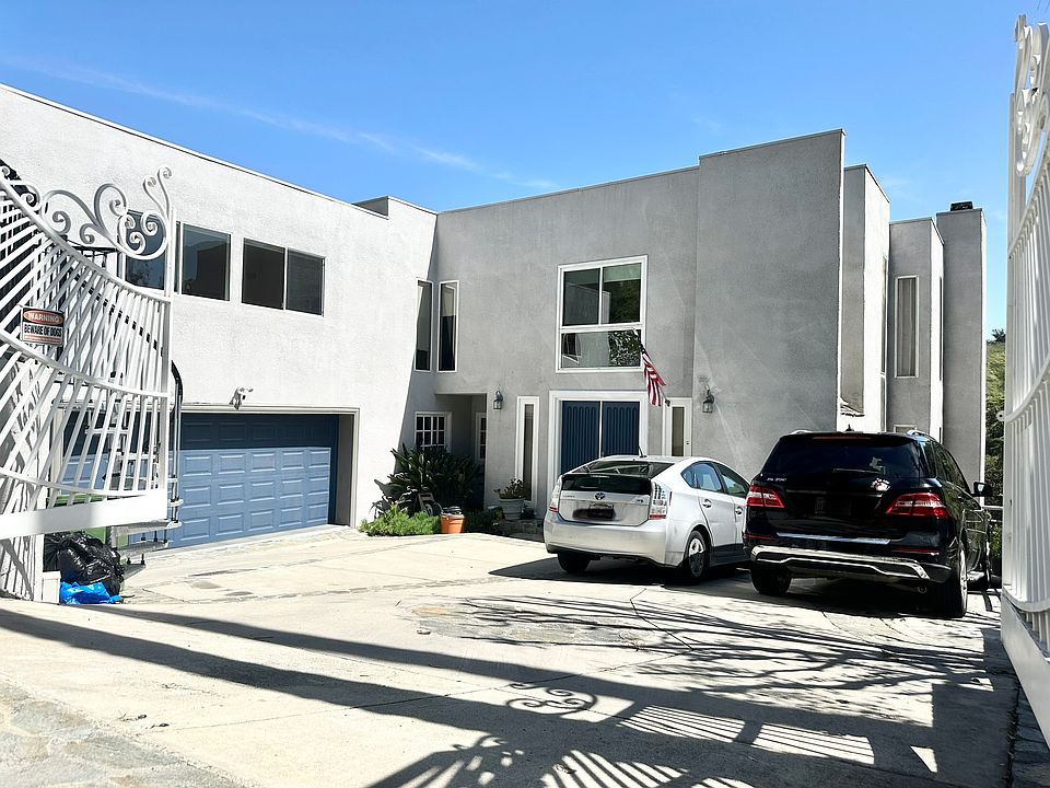 Iron Gate ,Driveway, 2 parking spots another 2-car garage , Plus street parking available
