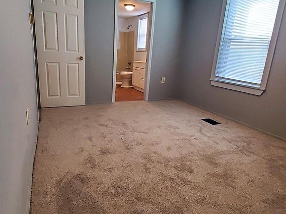Bedroom looking to bathroom