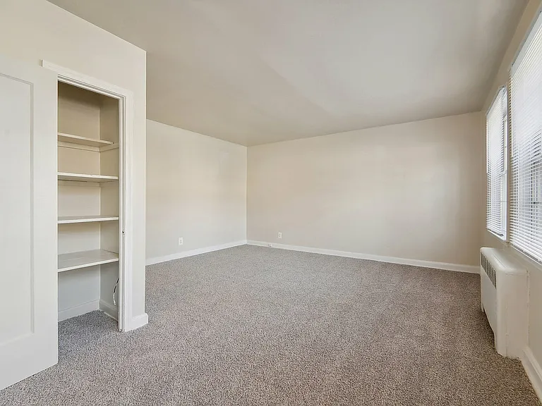 Experience the warmth of natural light in this spacious, versatile room.