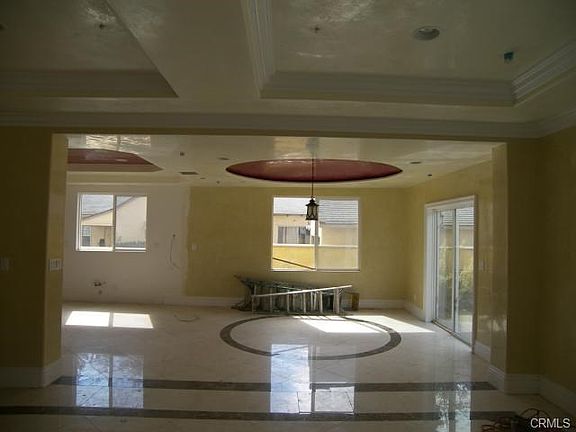 DINING ROOM WITH CUSTOM CEILINGS AND MARBLE FLOORING...