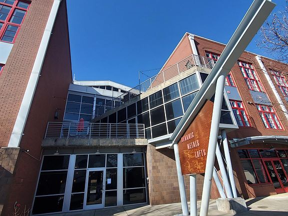 Dynamic Metals Lofts front entrance and east side patios.