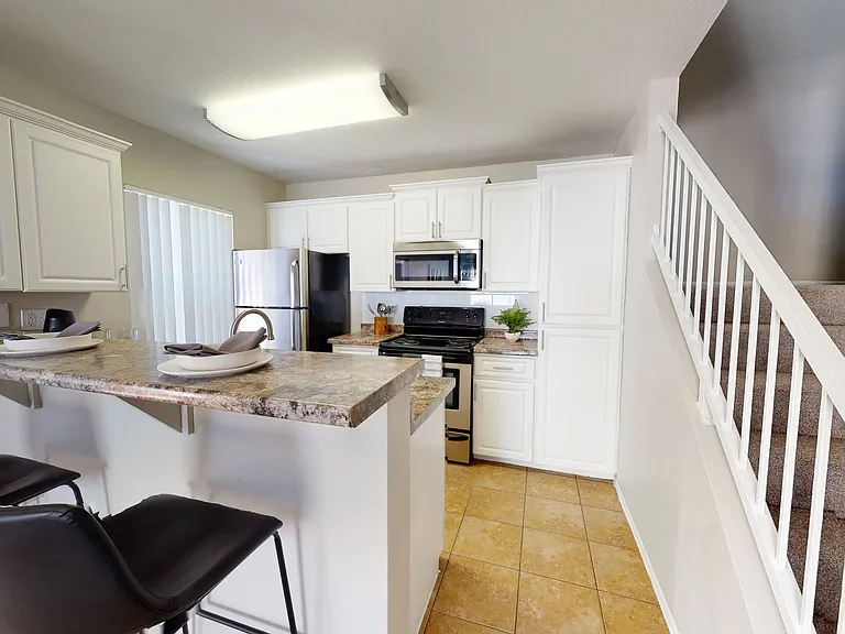 Our townhomes offer expansive kitchens with subway tile backsplashes, granite-style counters, and stainless-steel Frigidaire-brand appliances for an incredible homey feel and a space you cherish.