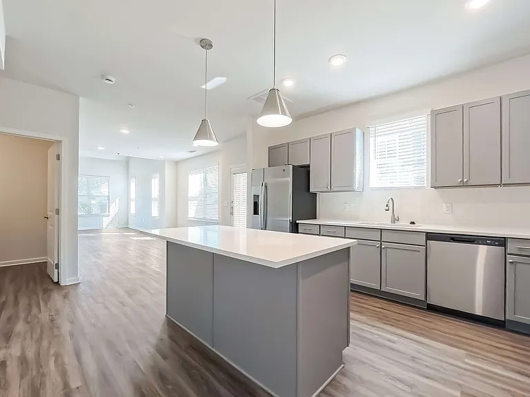 Kitchen featuring an island and stainless steel appliance package.