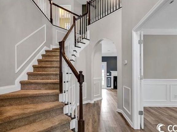 Stairs to the second floor, where room and bathroom are located.