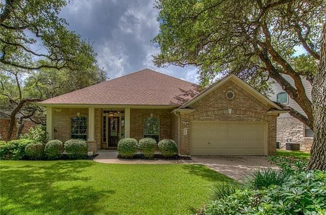 Beautiful and rare 1-story home on private drive.  Large trees and great landscaping really show off the home.