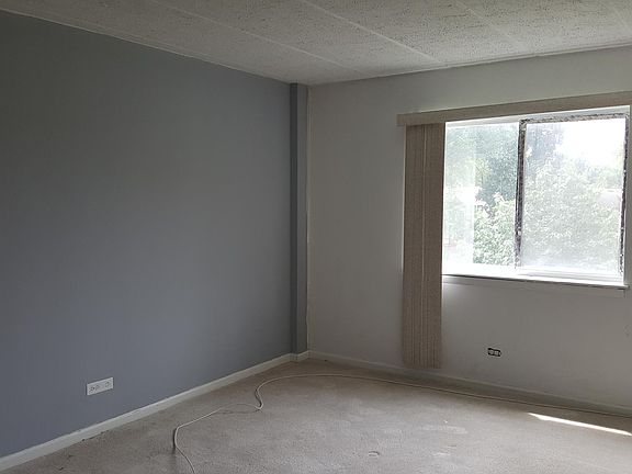 Large bedroom with 2 large mirrored closets.