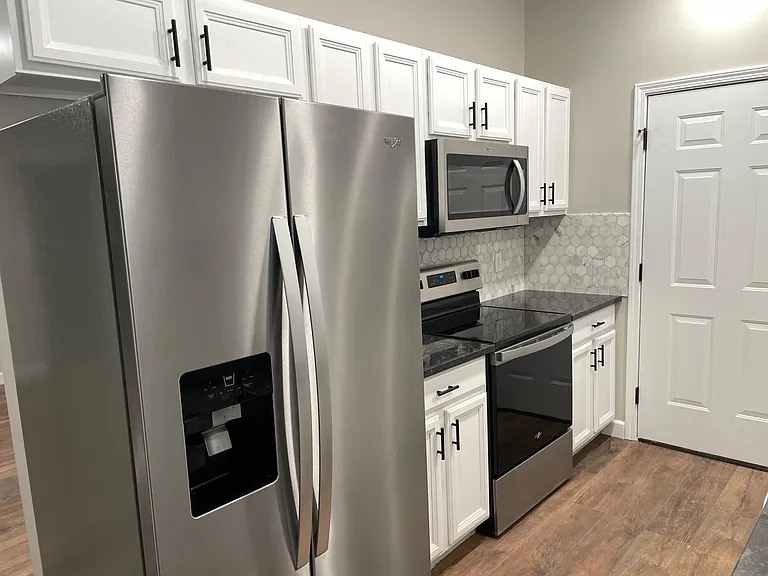 Brand new SS Appliances, Granite Countertops and tile backsplash