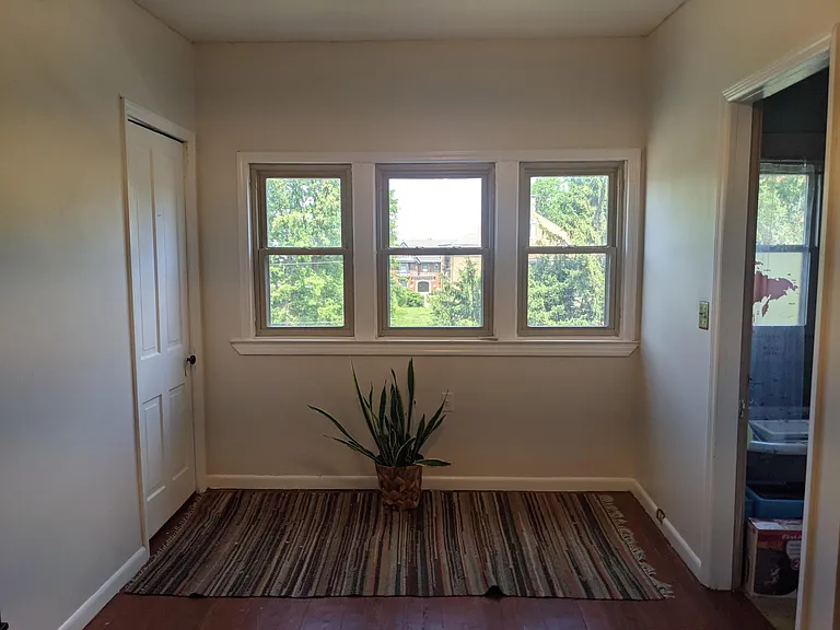 Third floor living space windows near bathroom and closet.