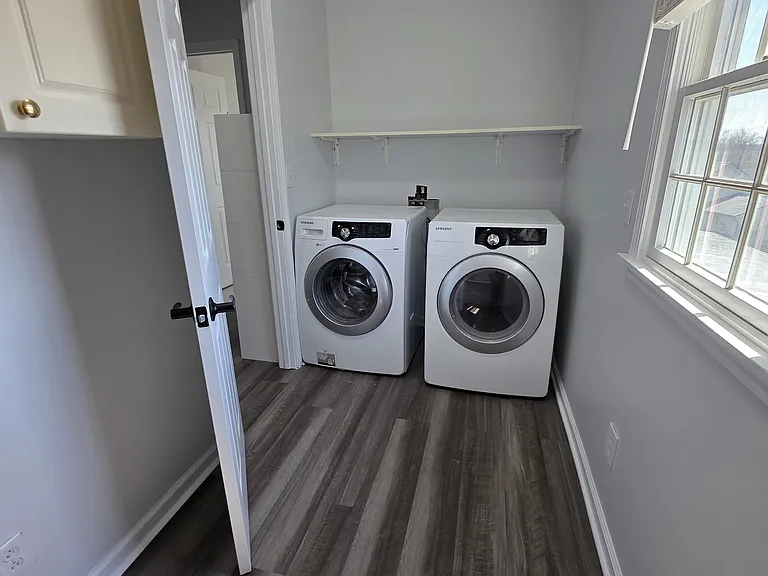 Washer and Dryer room with lots of cabinet and storage space