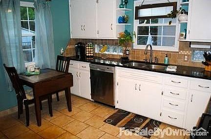 Newly Renovated Kitchen
						:
						SS appls, tiled backsplsh & floor, granite ctrtops, glass blocks for xtra light