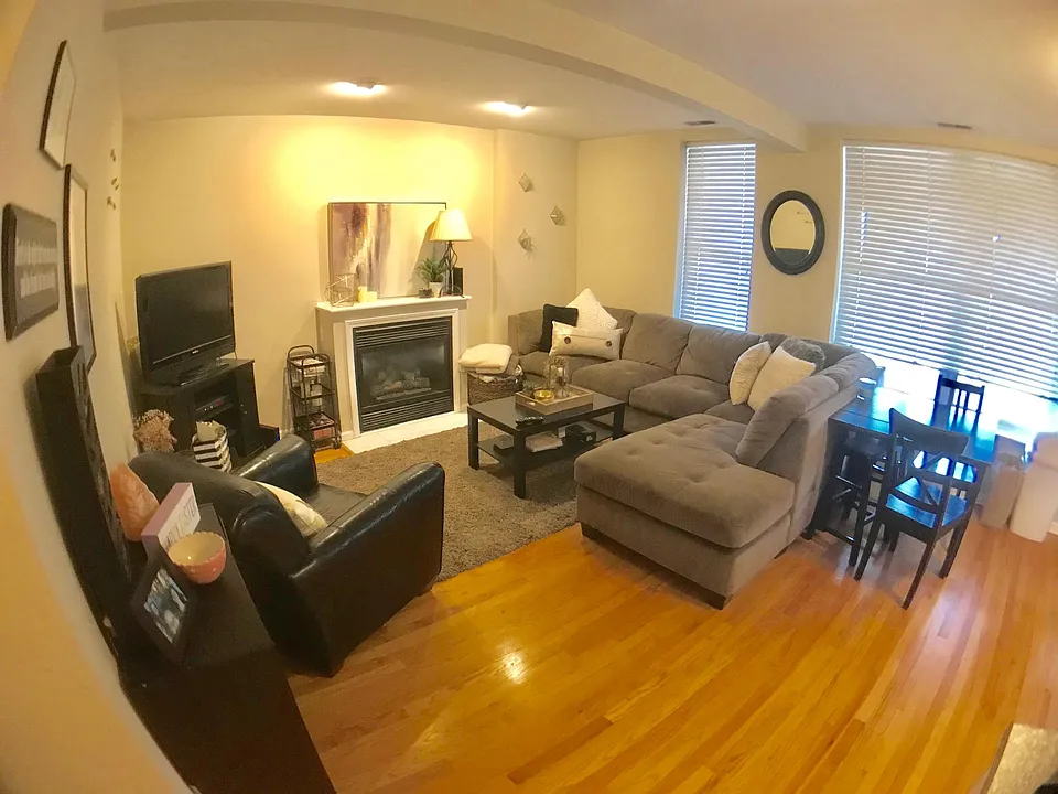 Living room with hardwood floors fireplace