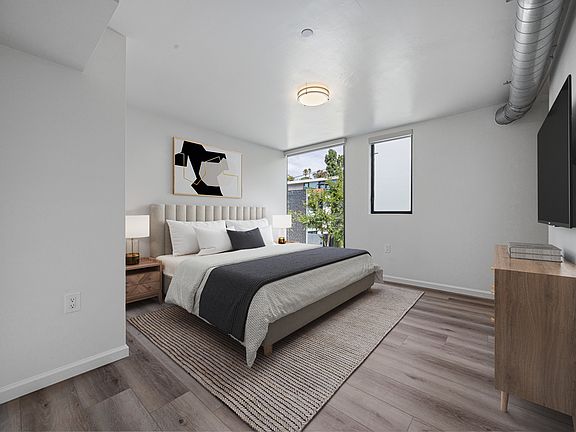 Bedroom #2 _ The largest bedroom, featuring a walk-in closet and brand-new modern floor-to-ceiling blackout curtains for style, comfort, and privacy.