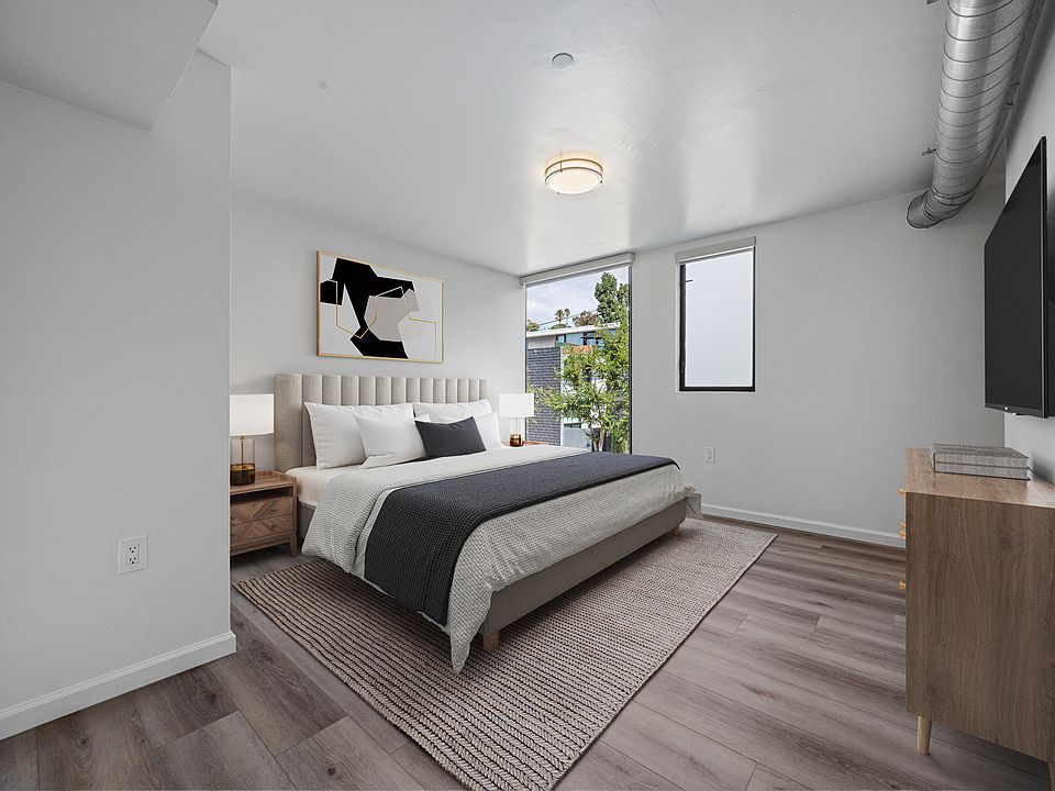 Bedroom #2 _ The largest bedroom, featuring a walk-in closet and brand-new modern floor-to-ceiling blackout curtains for style, comfort, and privacy.