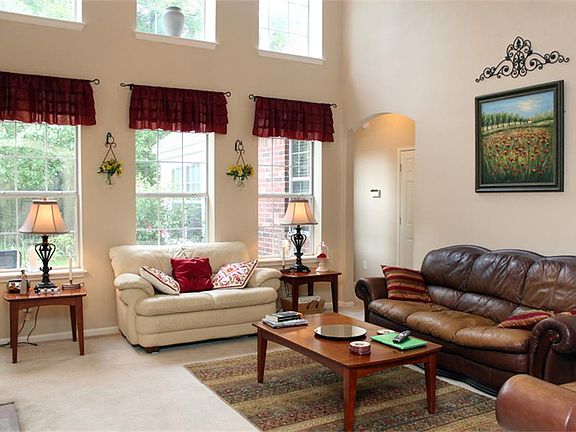 Light and Bright family room with high ceilings and overlooking beautiful landscaped back yard.
